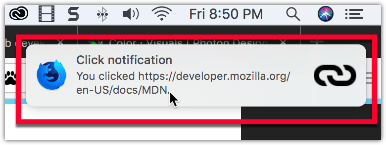 Example notification on macOS, located below the system clock, with a bold title reading "Click notification" followed by regular text reading "You clicked https://developer.mozilla.org/en-US/docs/MDN". The notification has the Firefox Nightly logo on the left side, and a link icon on the right.